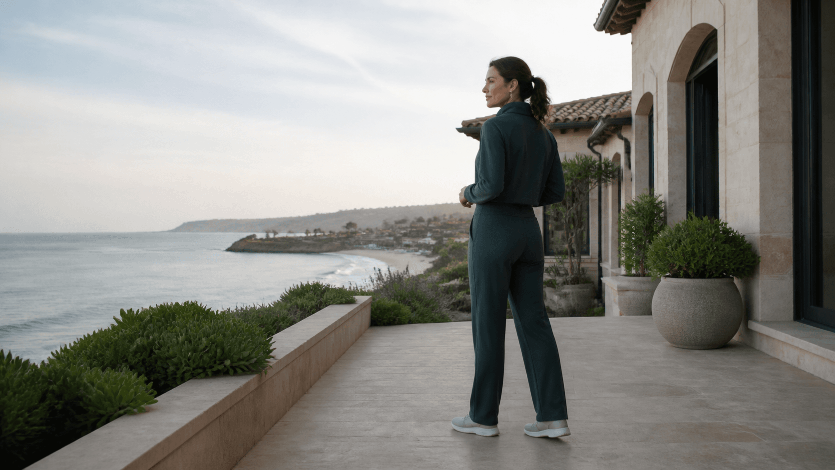 Woman in modest activewear considering lower-body contour after major weight loss